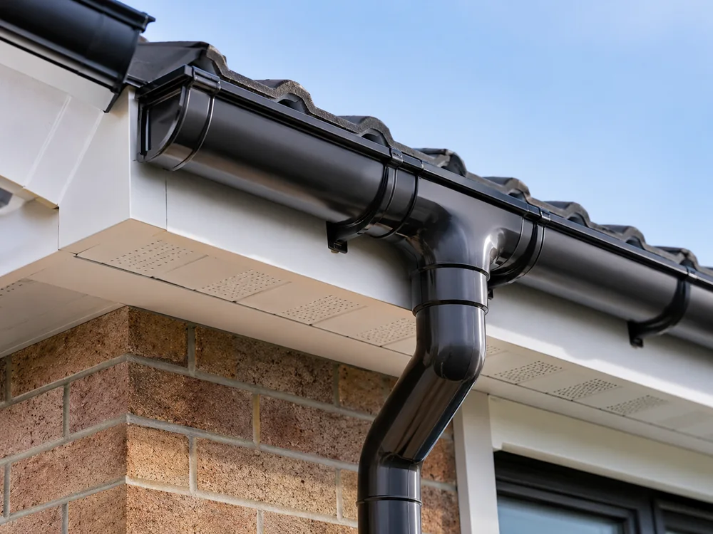 Black guttering fascia and soffit installation on a brick property in Leicester or Nottingham